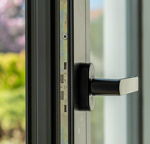 close up of a window handle on a modern window frame showcasing a sleek design enhancing security and functionality for 28 modern homes