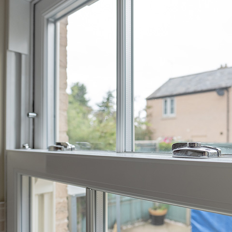 interior view of window hardware and frame highlighting security features and design improvements in residential settings including energy efficiency and 20 percent better insulation